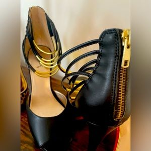 Black open toe strappy ankle heels.